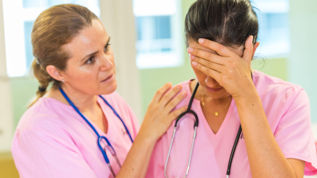 Lead nurse consoles fellow nurse during a stressful time.