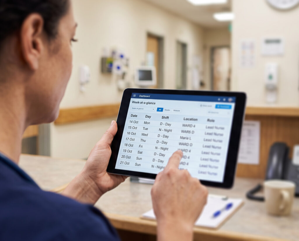 Nurse reviewing patient information on a digital dashboard
